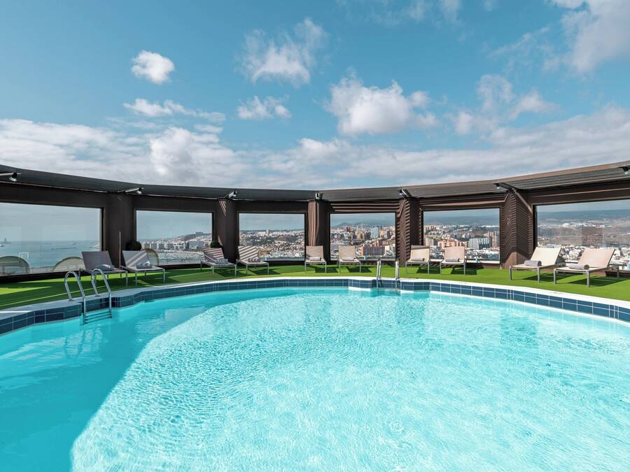 Outdoor pool, open noon to 6:00 PM, pool umbrellas, sun loungers