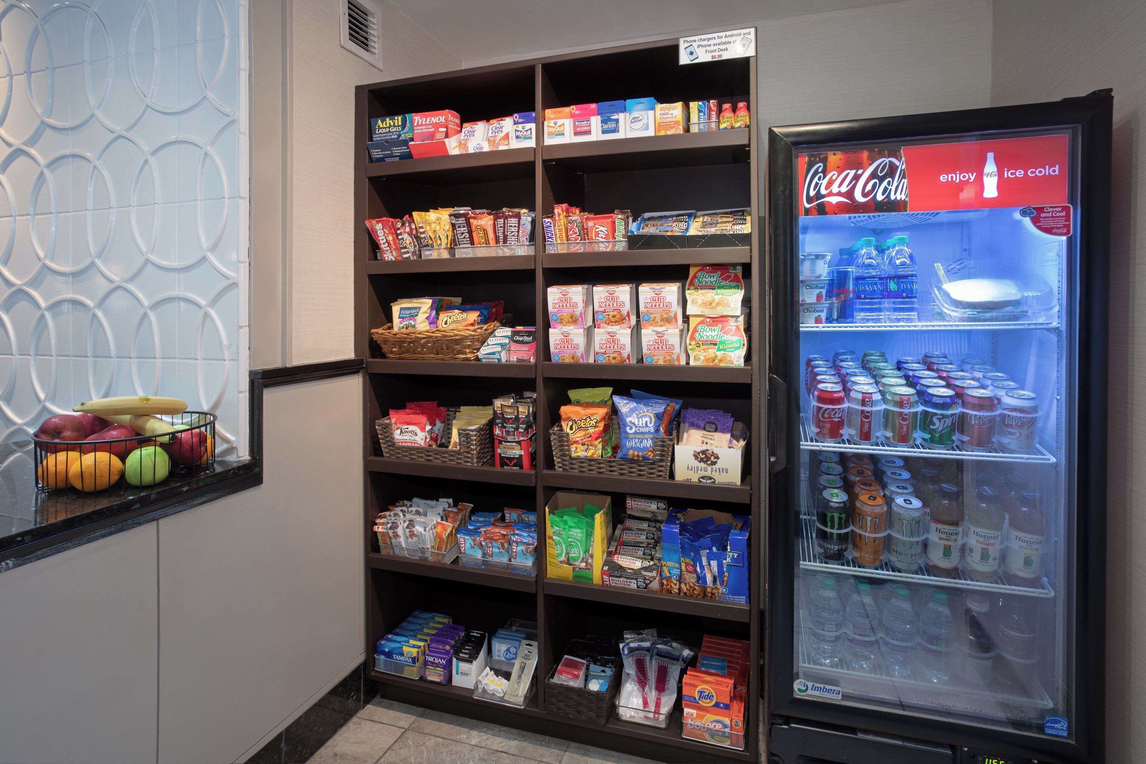 A self-service snack and drink station with various food items and beverages.