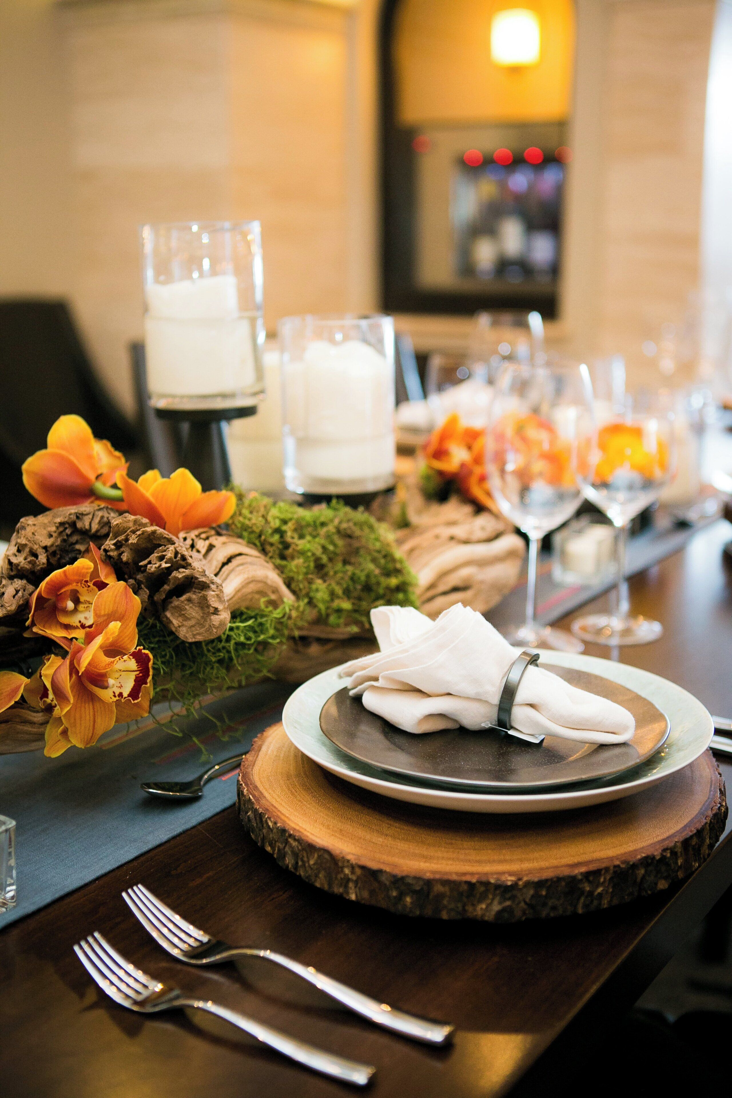 A table set for dining with plates, glasses, and cutlery.