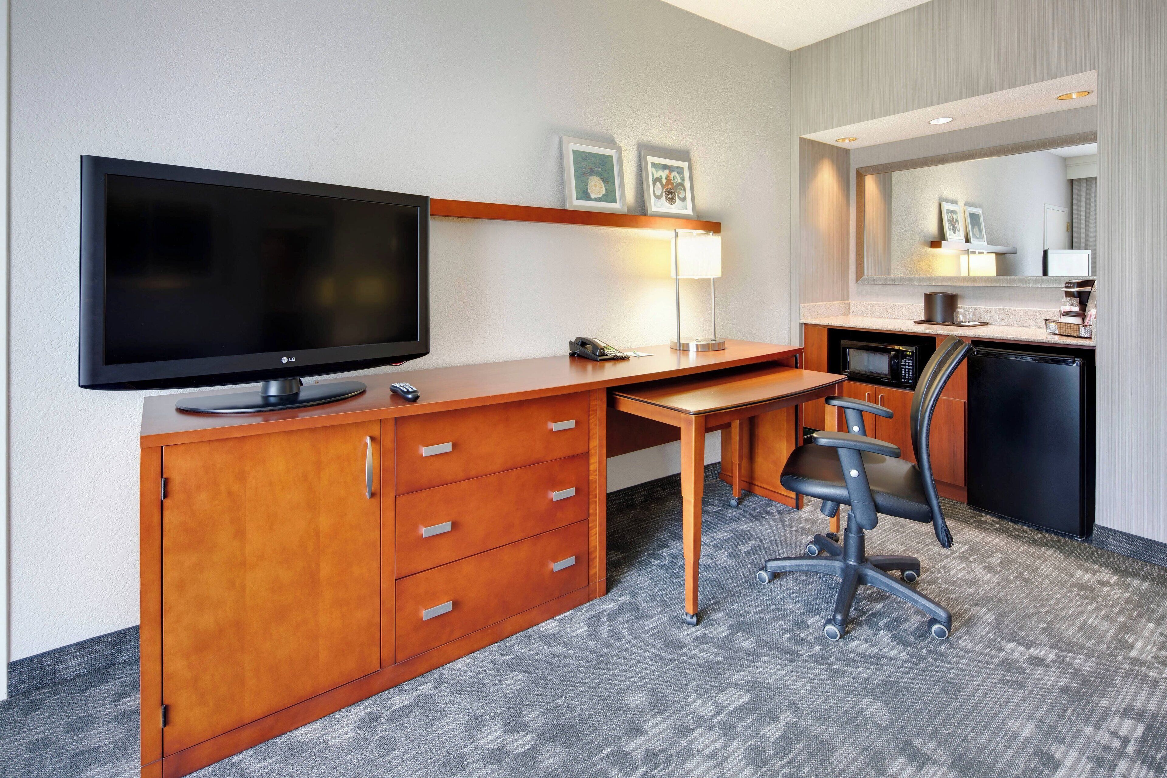 premium bedding, desk, blackout curtains, iron/ironing board