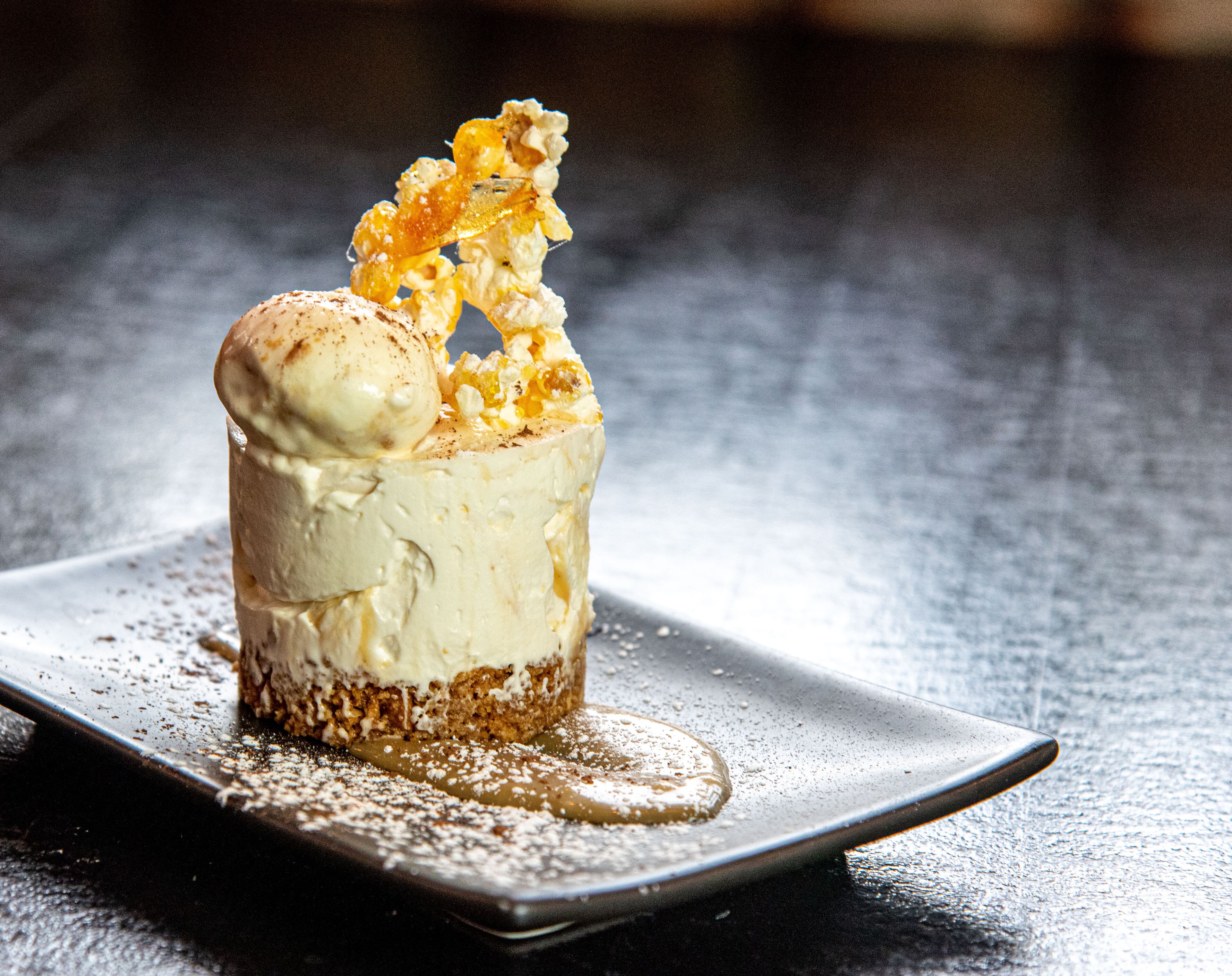 A dessert on a square plate.