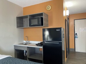 Full-size fridge, microwave, stovetop, coffee/tea maker
