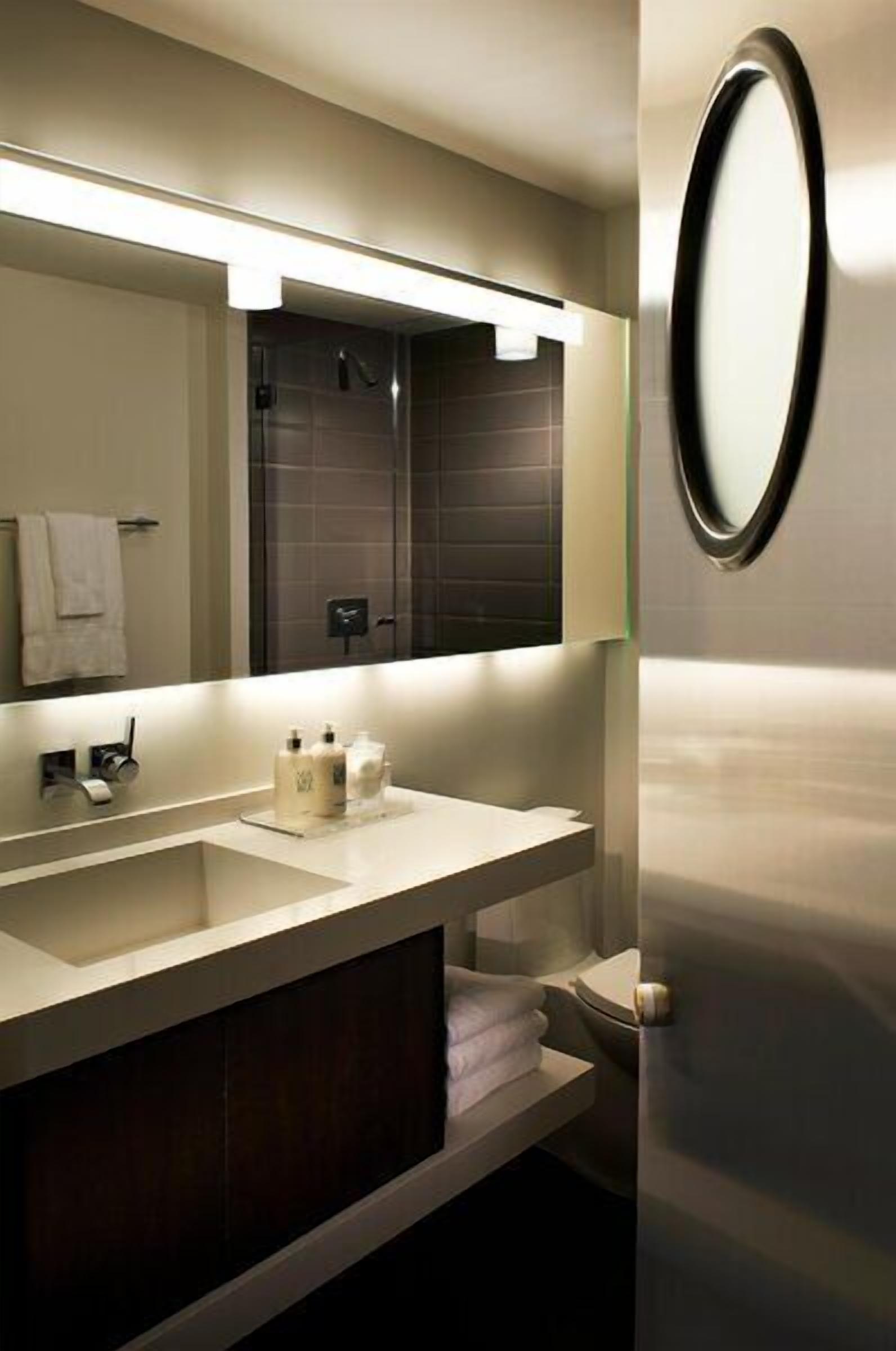 Shower, designer toiletries, hair dryer, bathrobes
