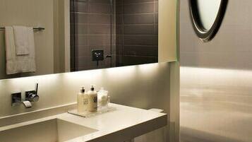 Shower, designer toiletries, hair dryer, bathrobes