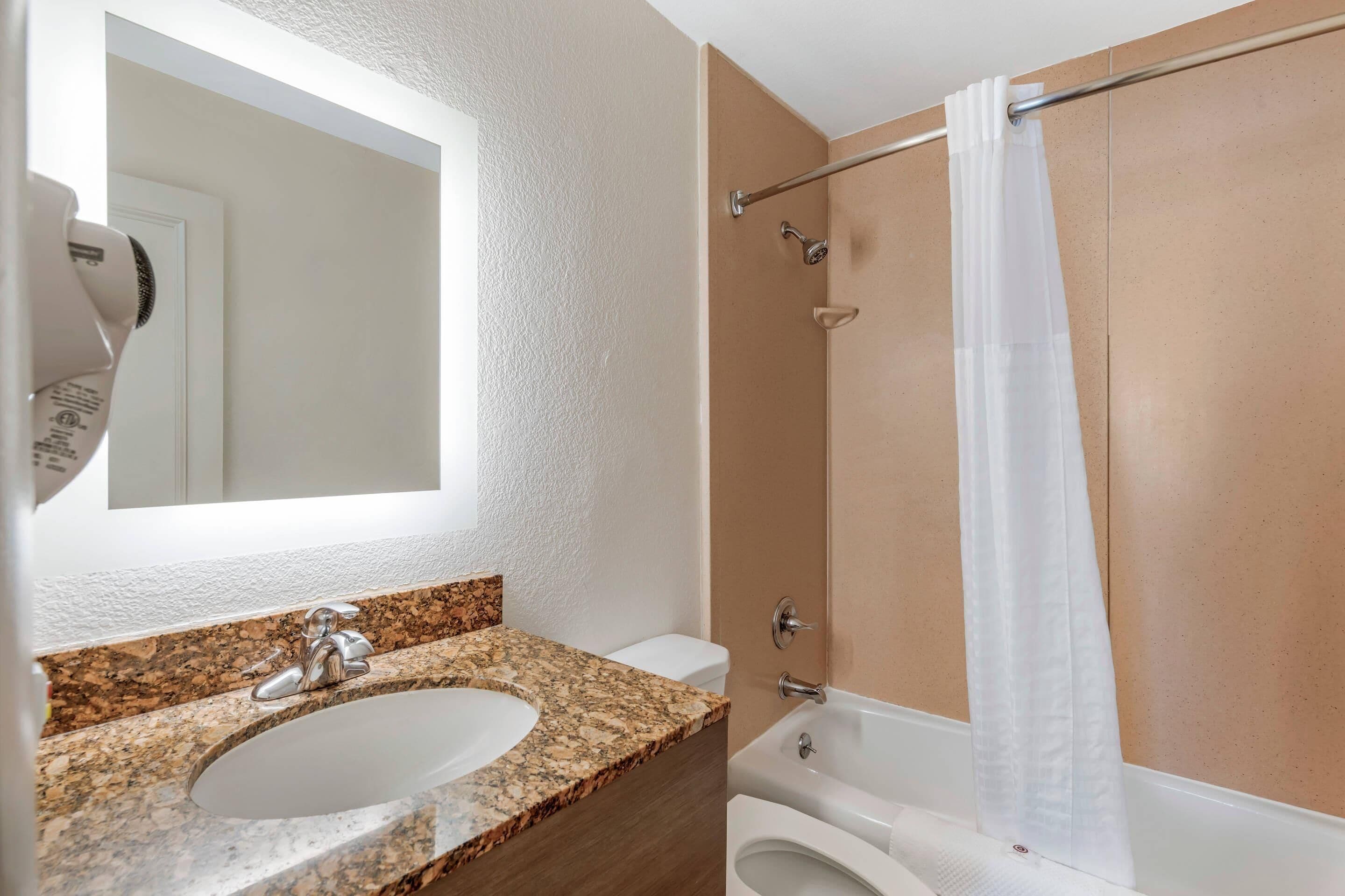 Desk, laptop workspace, blackout drapes, iron/ironing board