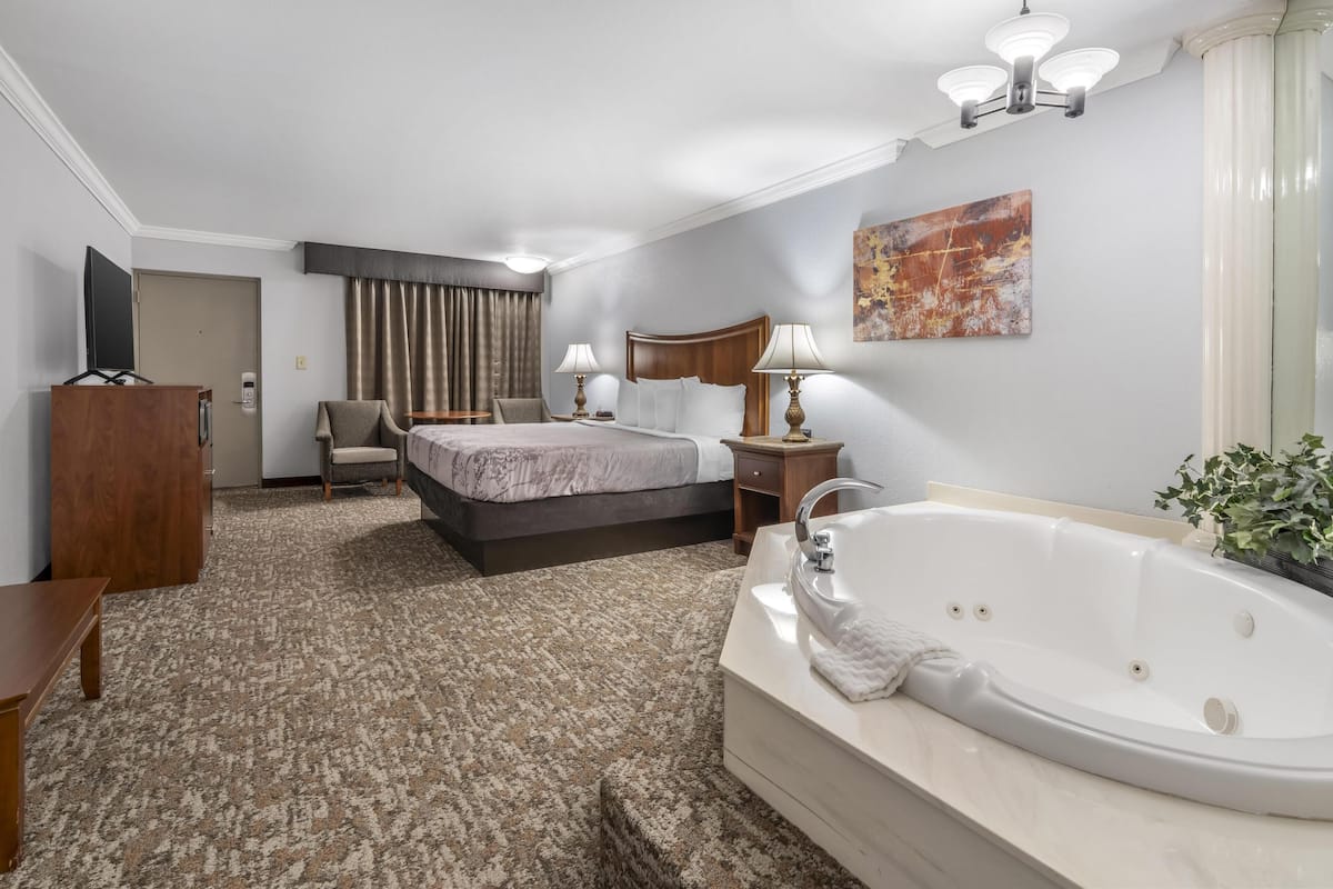 standard room, 1 king bed, non smoking, jetted tub (oversized room) | 1 bedroom, desk, iron/ironing board, free cots/infant beds