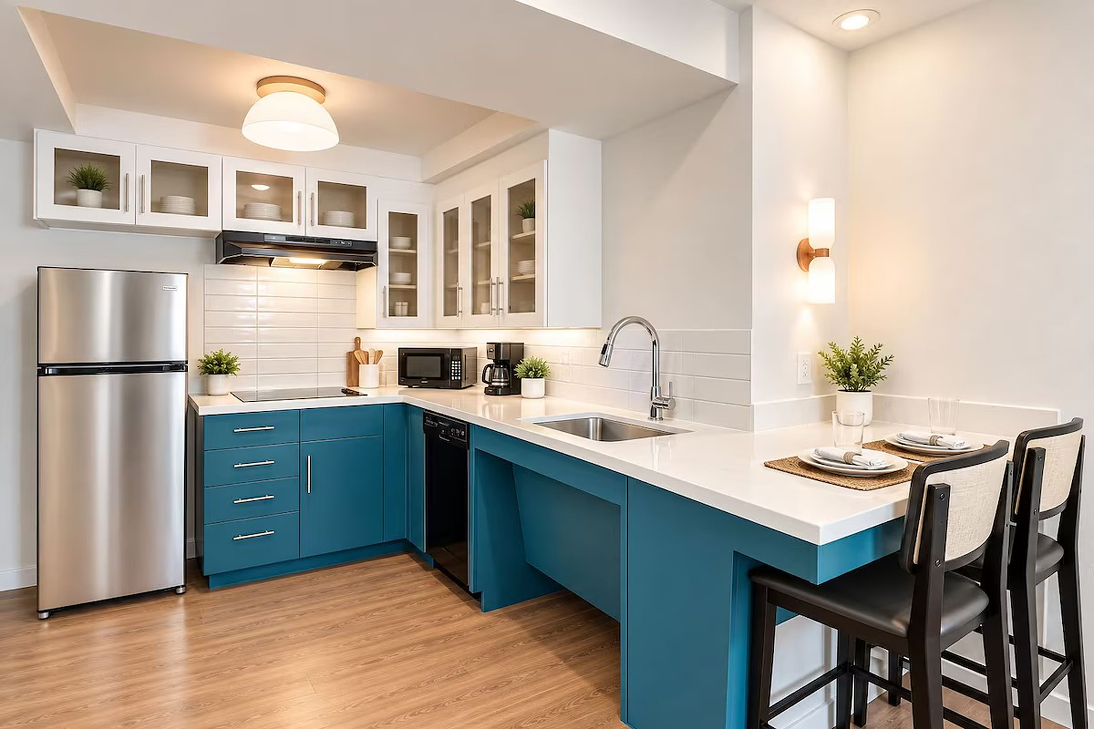 A modern kitchen with a stainless steel refrigerator, a microwave, and a dishwasher.
