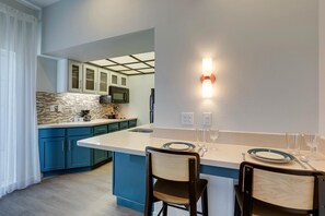 Full-size fridge, microwave, stovetop, dishwasher
