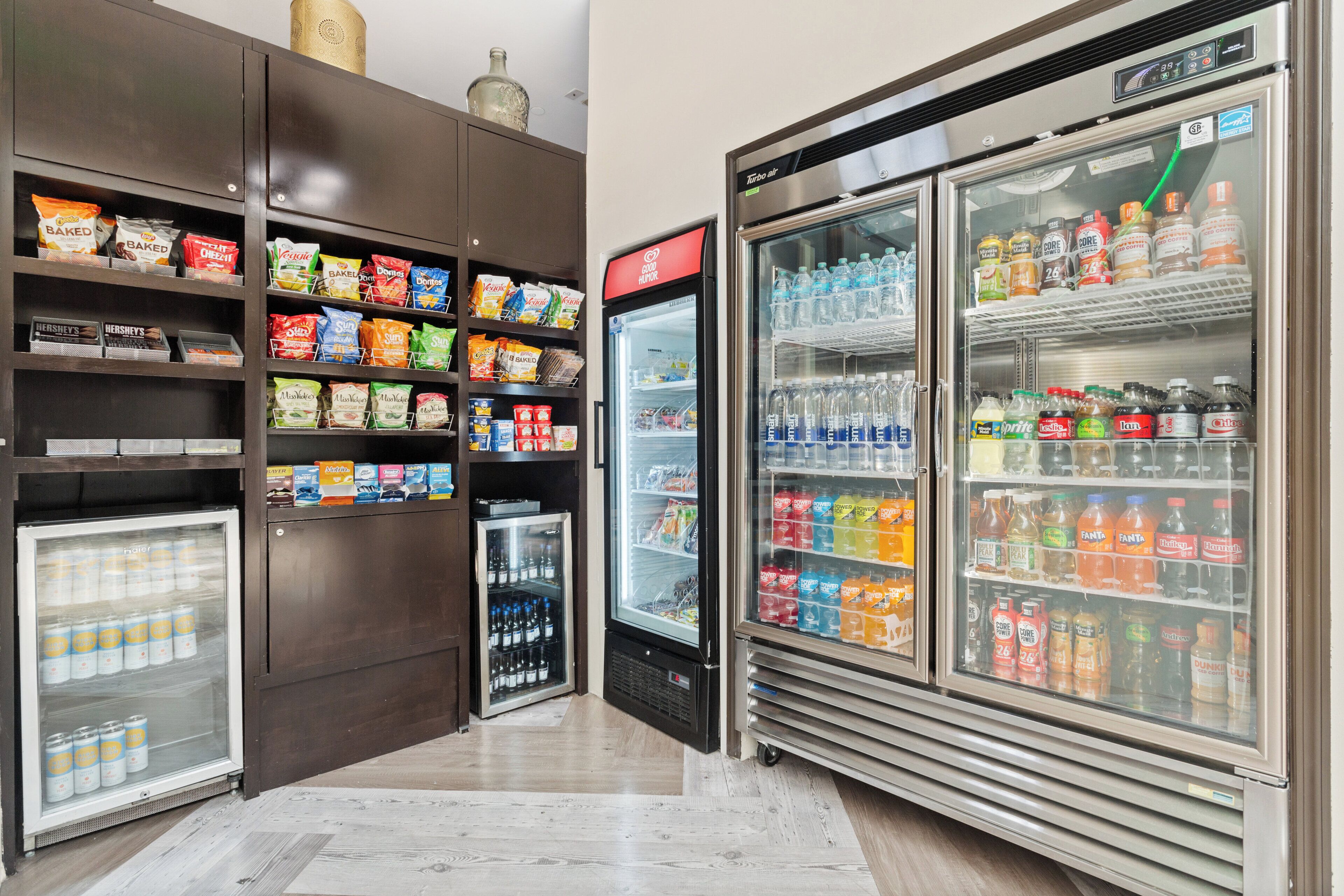 A refrigerated display case with various snacks and beverages.