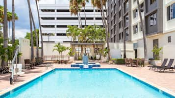 Outdoor pool, pool umbrellas, sun loungers