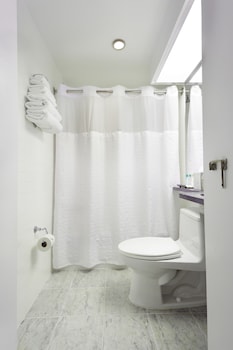 Bathtub, hair dryer, towels at The Shoreham Hotel