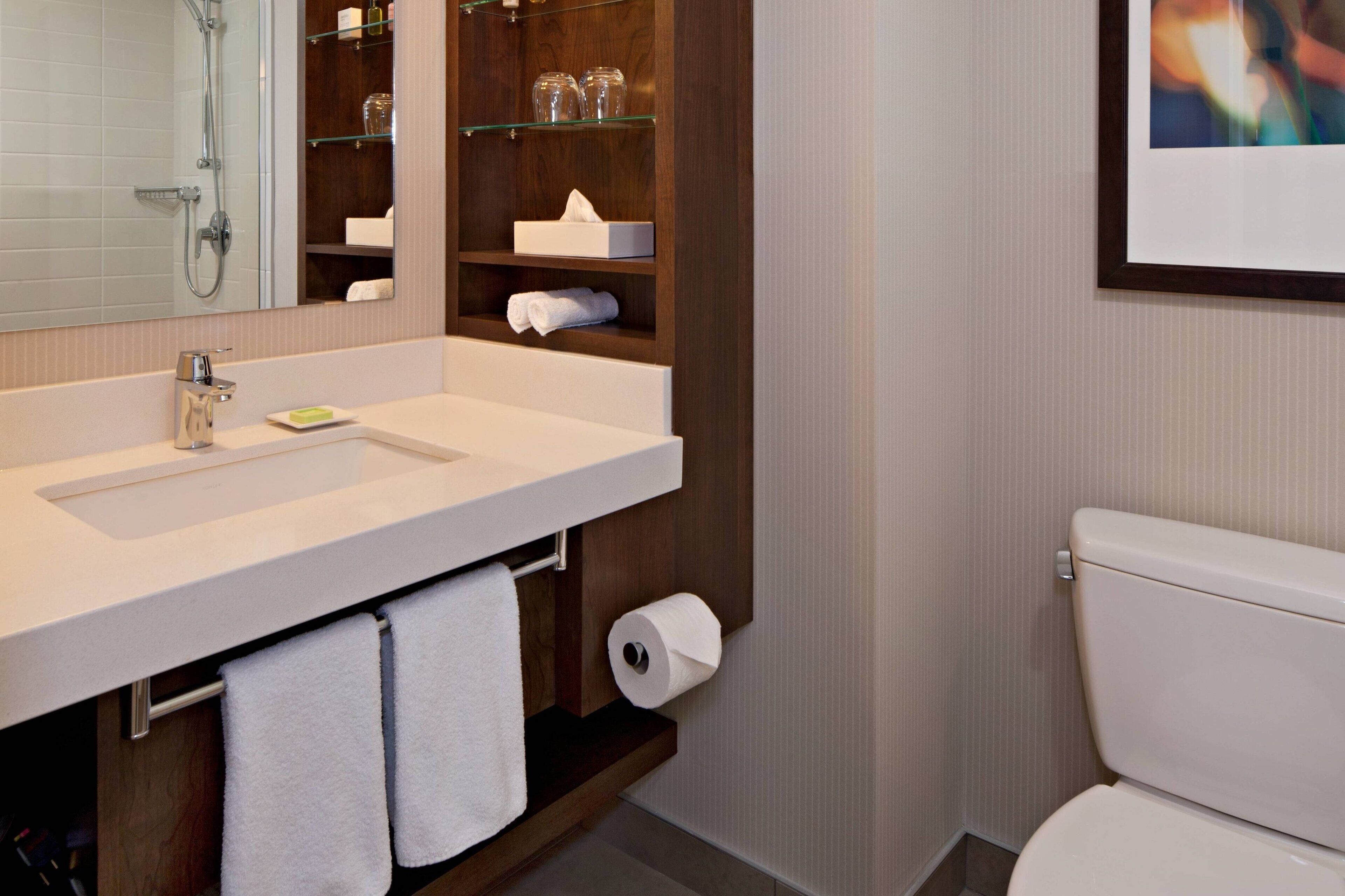 separate bathtub and shower, designer toiletries, hair dryer, towels