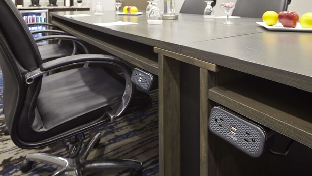A conference room with a long table, chairs, and a coffee machine. - Embassy Suites by Hilton Atlanta Galleria (Atlanta)