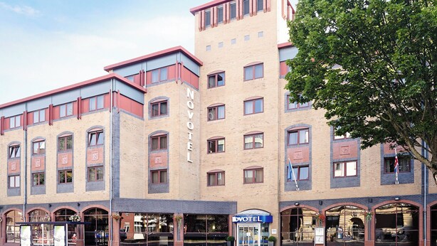A hotel with a modern design, featuring multiple floors and a prominent 'HOTEL' sign. - Novotel Bristol Centre (Bristol)