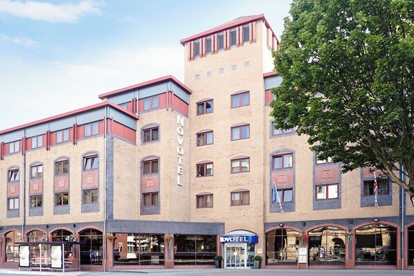 A hotel with a modern design, featuring multiple floors and a prominent 'HOTEL' sign. - Novotel Bristol Centre (Bristol)