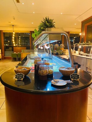 A breakfast buffet with various food items and a coffee station. - Novotel Bristol Centre (Bristol)