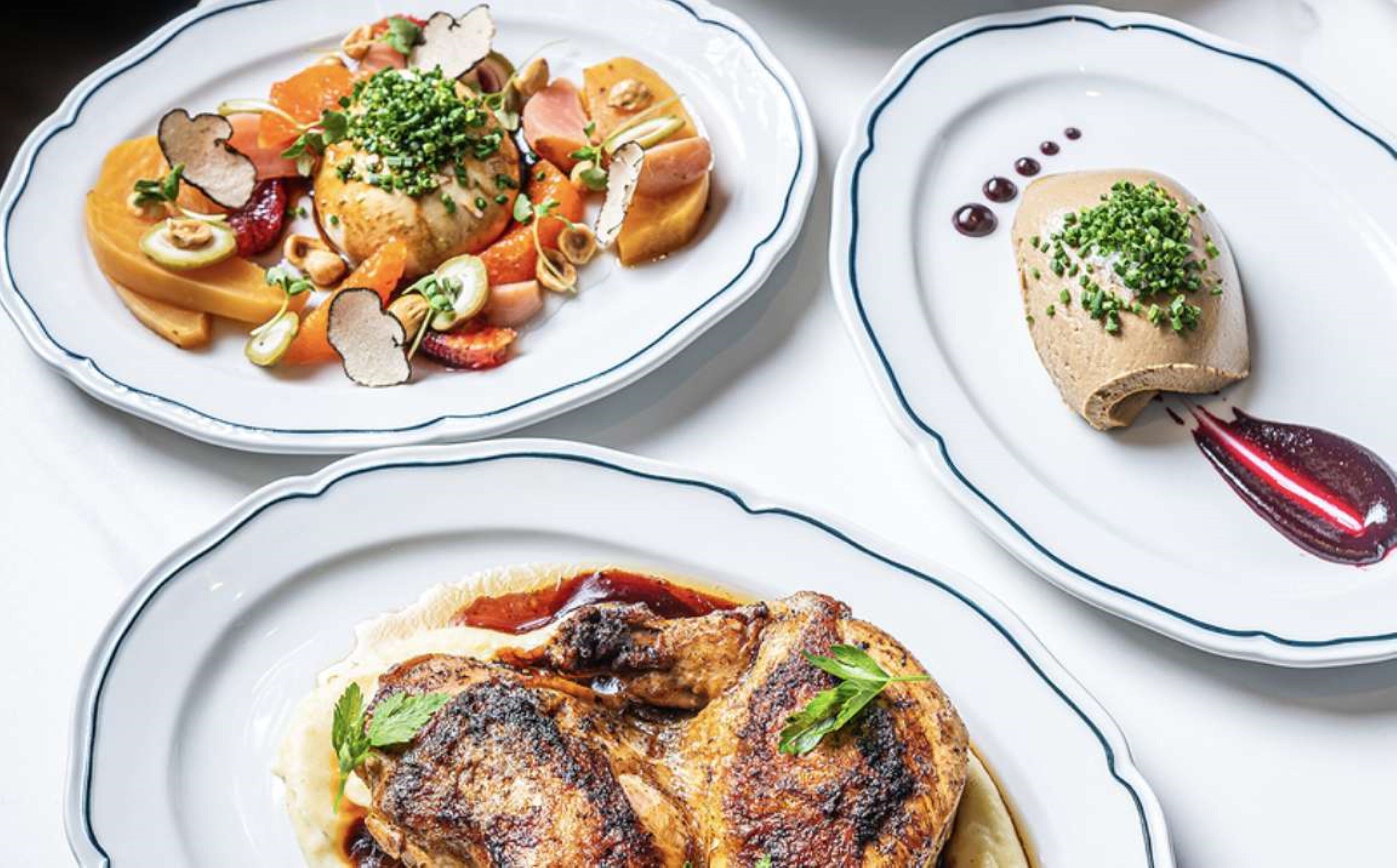 Three plates of food with different dishes.