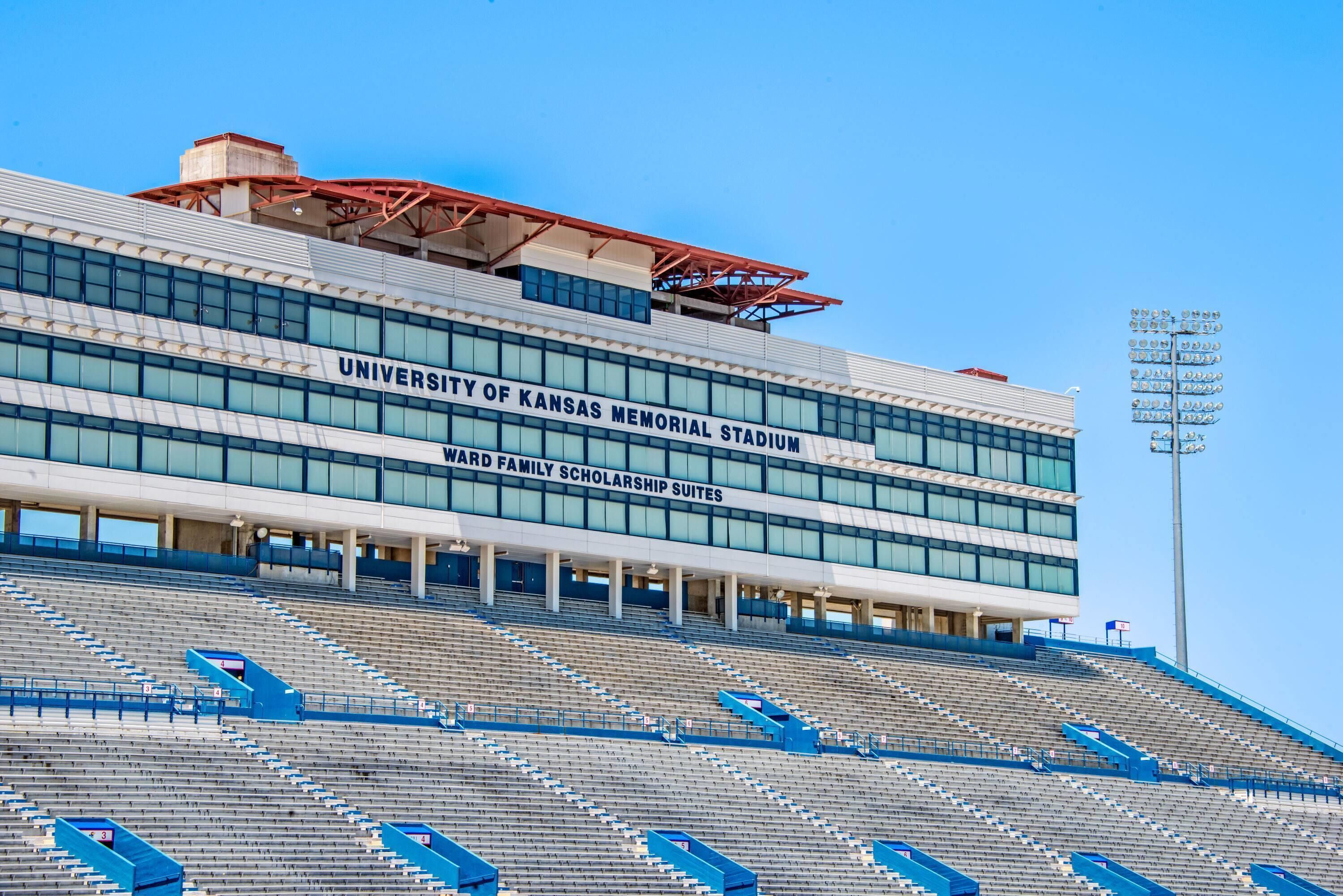 The University of Kansas Memorial Stadium with a clear blue sky.