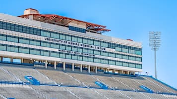 The University of Kansas Memorial Stadium with a clear blue sky.