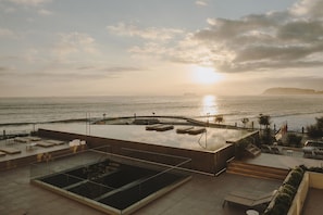 Seasonal outdoor pool, open 11:00 AM to 7:00 PM, sun loungers