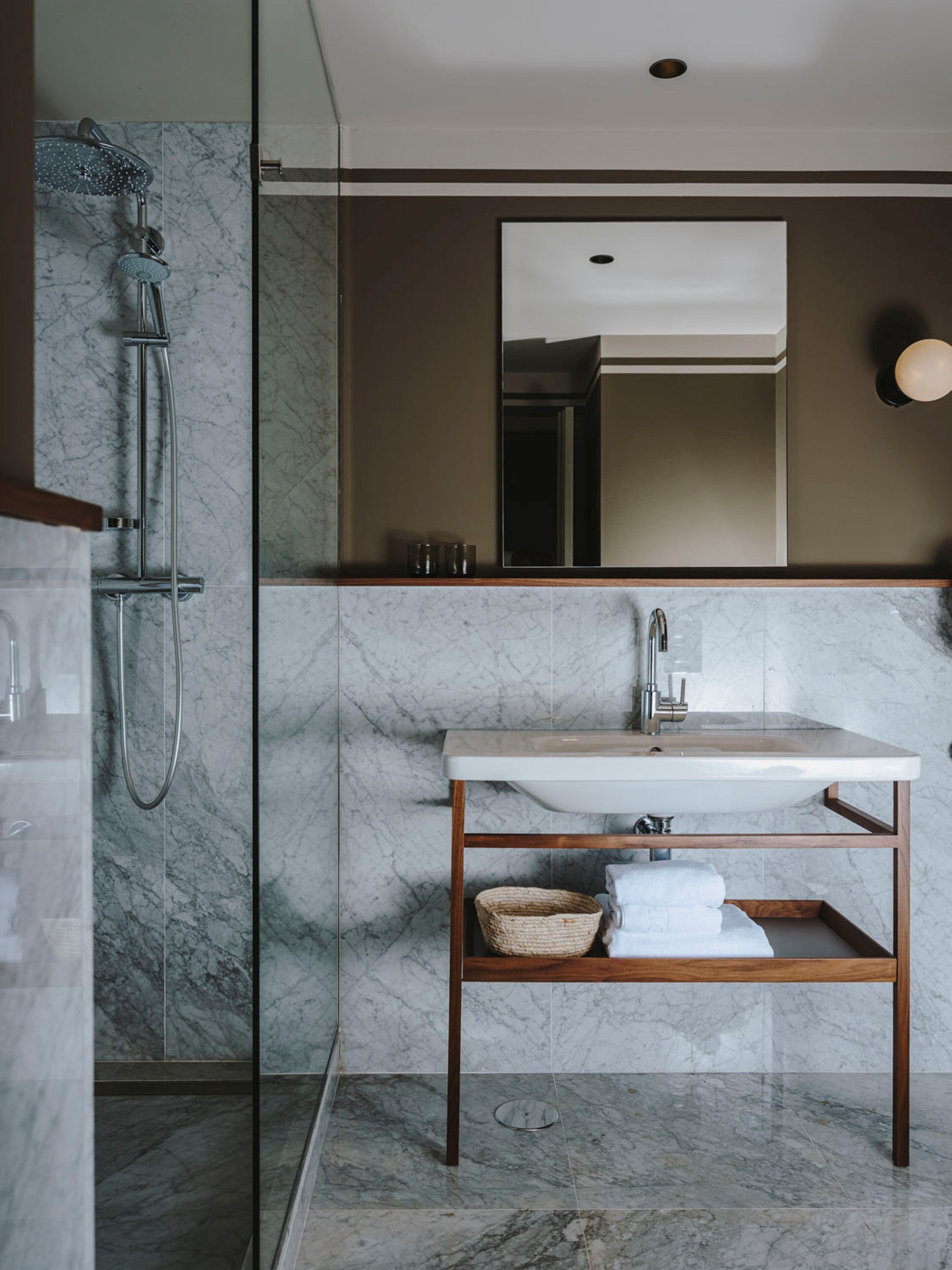 deluxe suite | bathroom | rainfall showerhead, free toiletries, hair dryer, towels