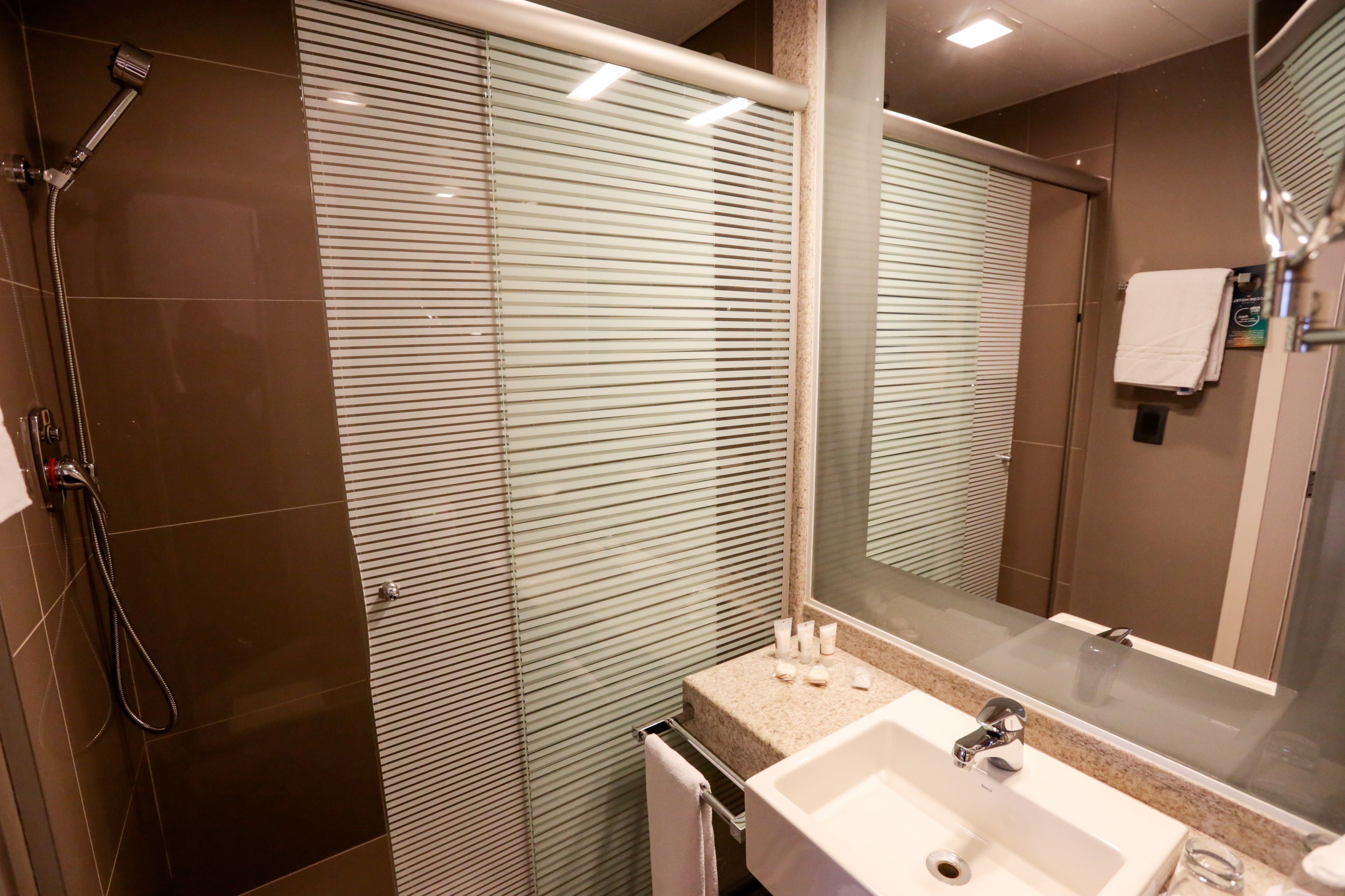 shower, eco-friendly toiletries, hair dryer, towels