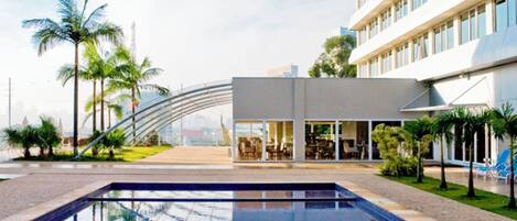 Outdoor pool, open 6:00 AM to 10:00 PM, pool umbrellas, sun loungers