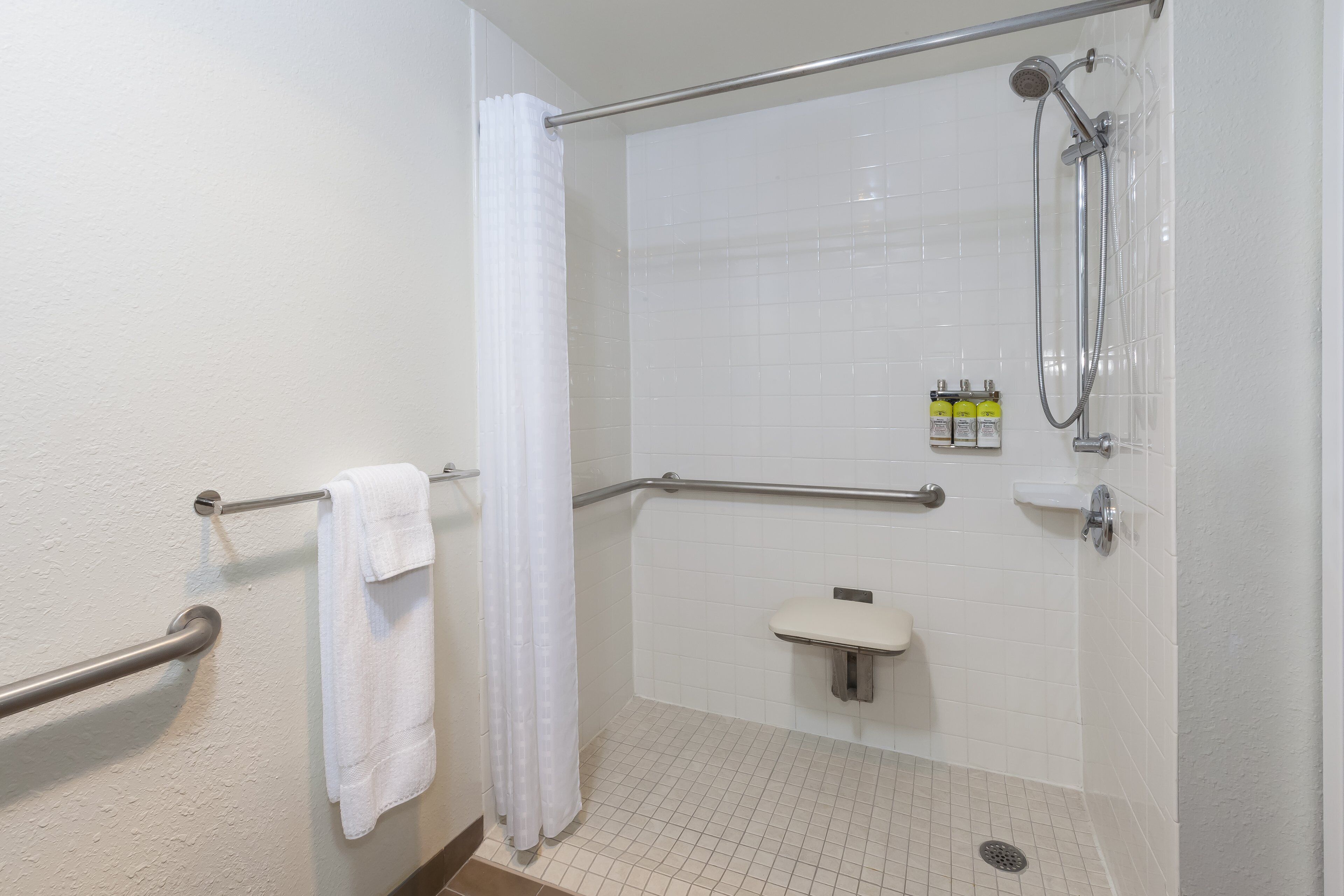 studio suite, 1 queen bed, accessible (communication, transfer shower) | bathroom | combined shower/bathtub, free toiletries, hair dryer, towels