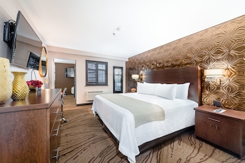 Suite, 1 King Bed, Balcony | Pillowtop beds, in-room safe, desk, laptop workspace at Ellis Island Hotel