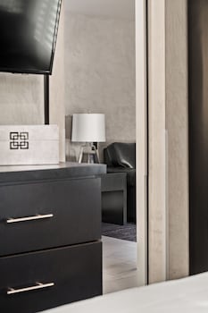 Suite, 1 King Bed, Balcony | Pillowtop beds, in-room safe, desk, laptop workspace at Ellis Island Hotel