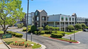 A Quality Inn hotel with a modern design, a parking lot, and well-maintained landscaping. - Quality Inn Duluth - Atlanta Northeast (Duluth)