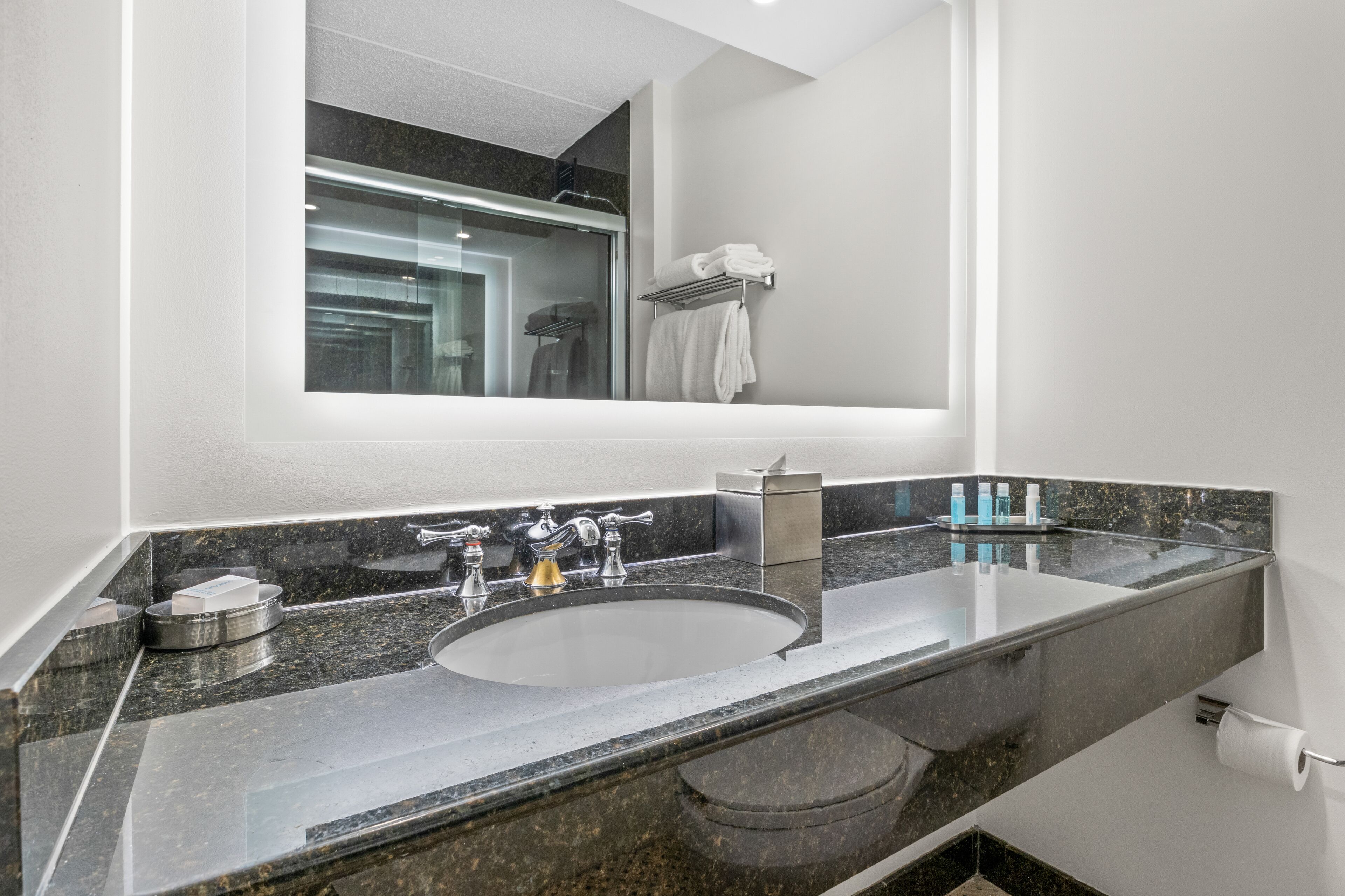 designer toiletries, hair dryer, towels