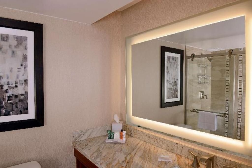 Designer toiletries, hair dryer, bathrobes, slippers