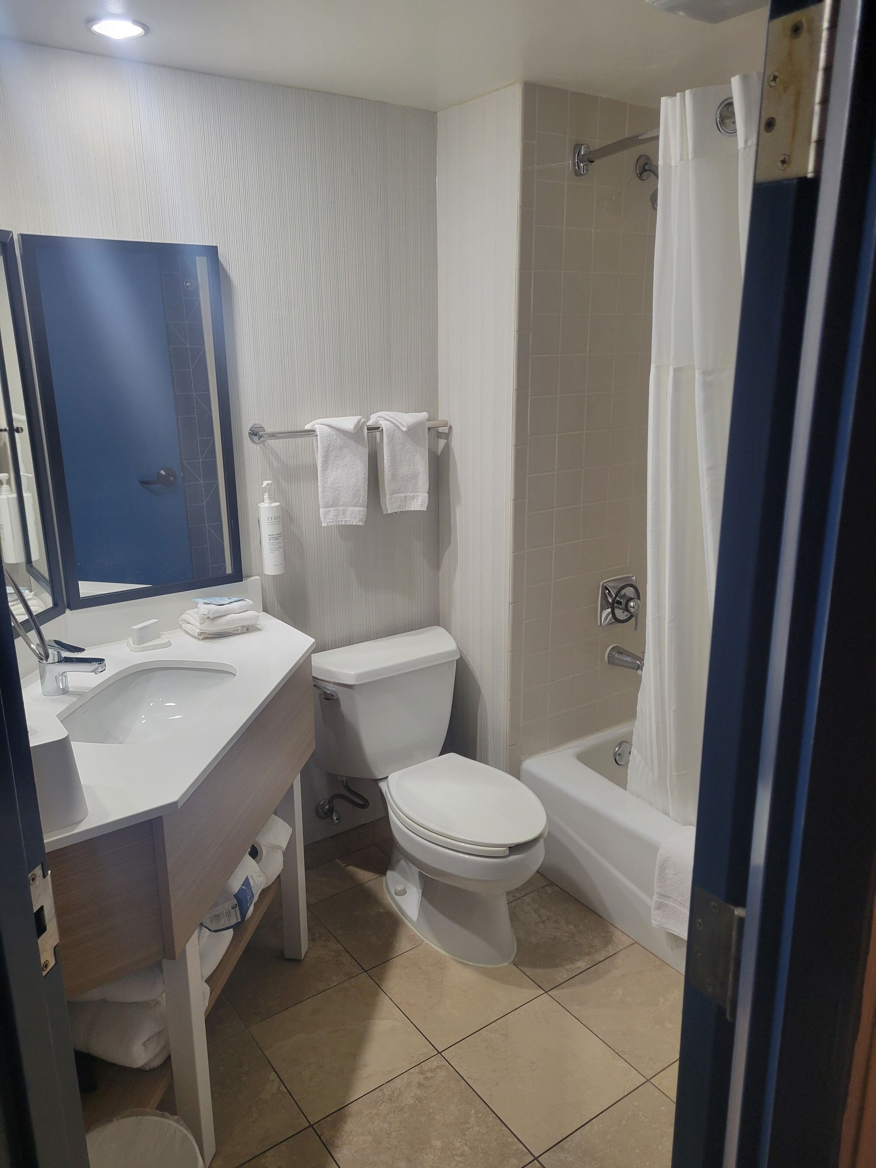 room, 2 queen beds | bathroom | combined shower/bathtub, free toiletries, hair dryer, towels