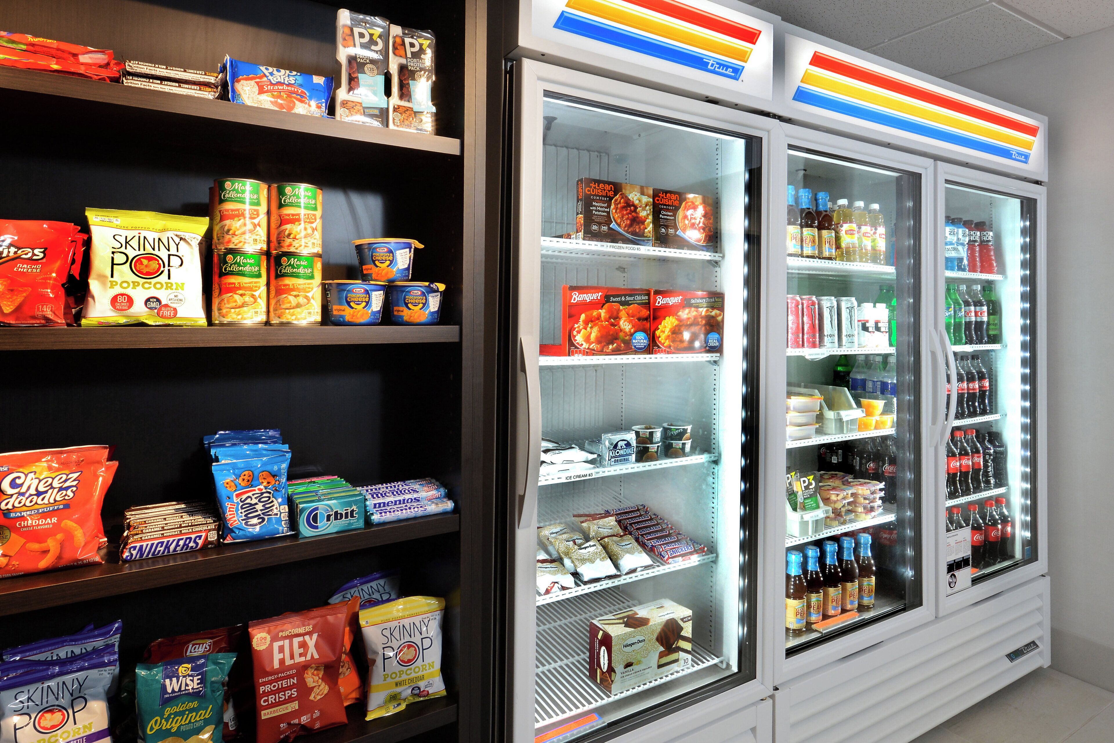 A snack and beverage vending machine with various snacks and drinks.