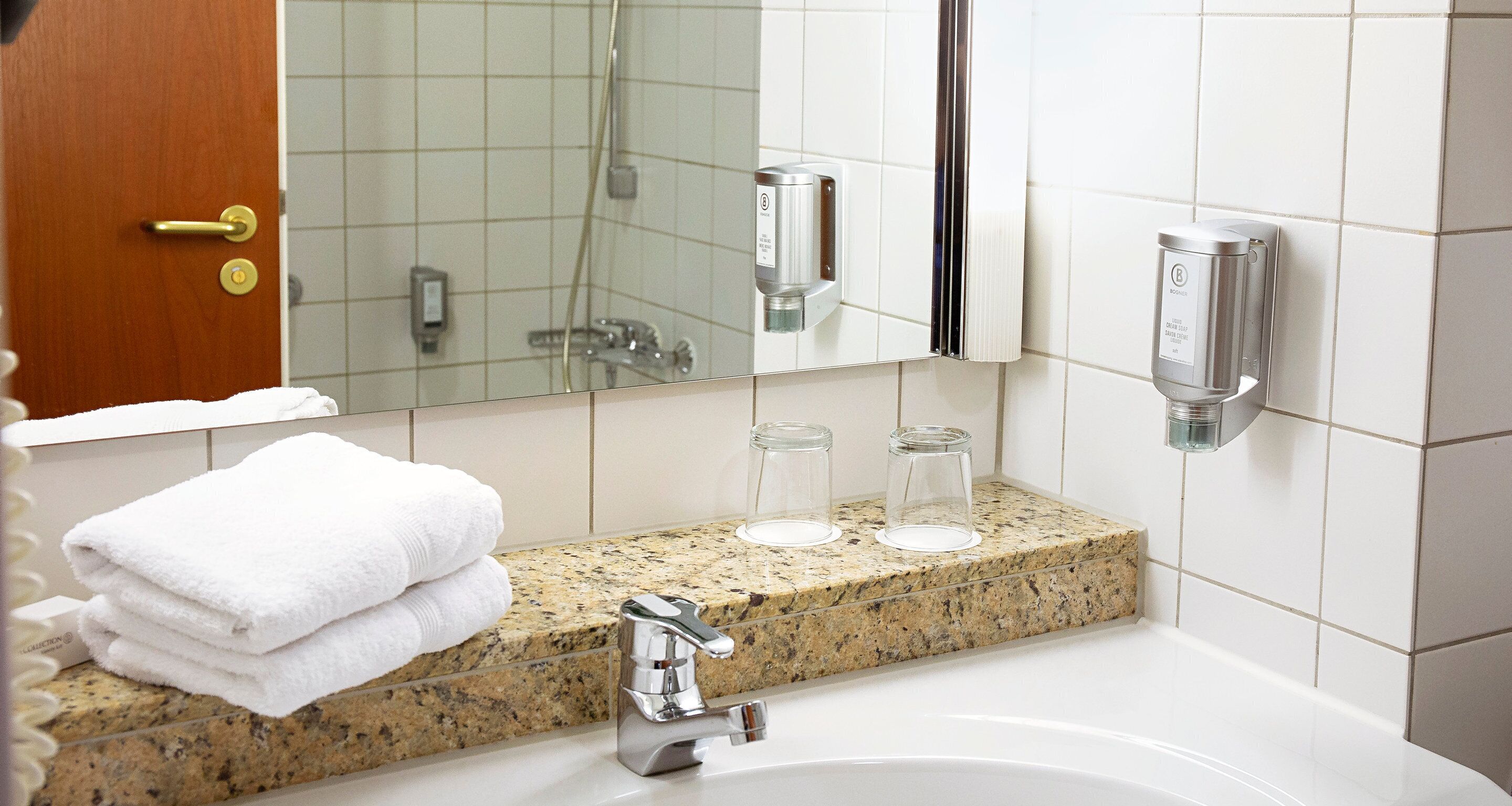 eco-friendly toiletries, hair dryer, slippers, towels