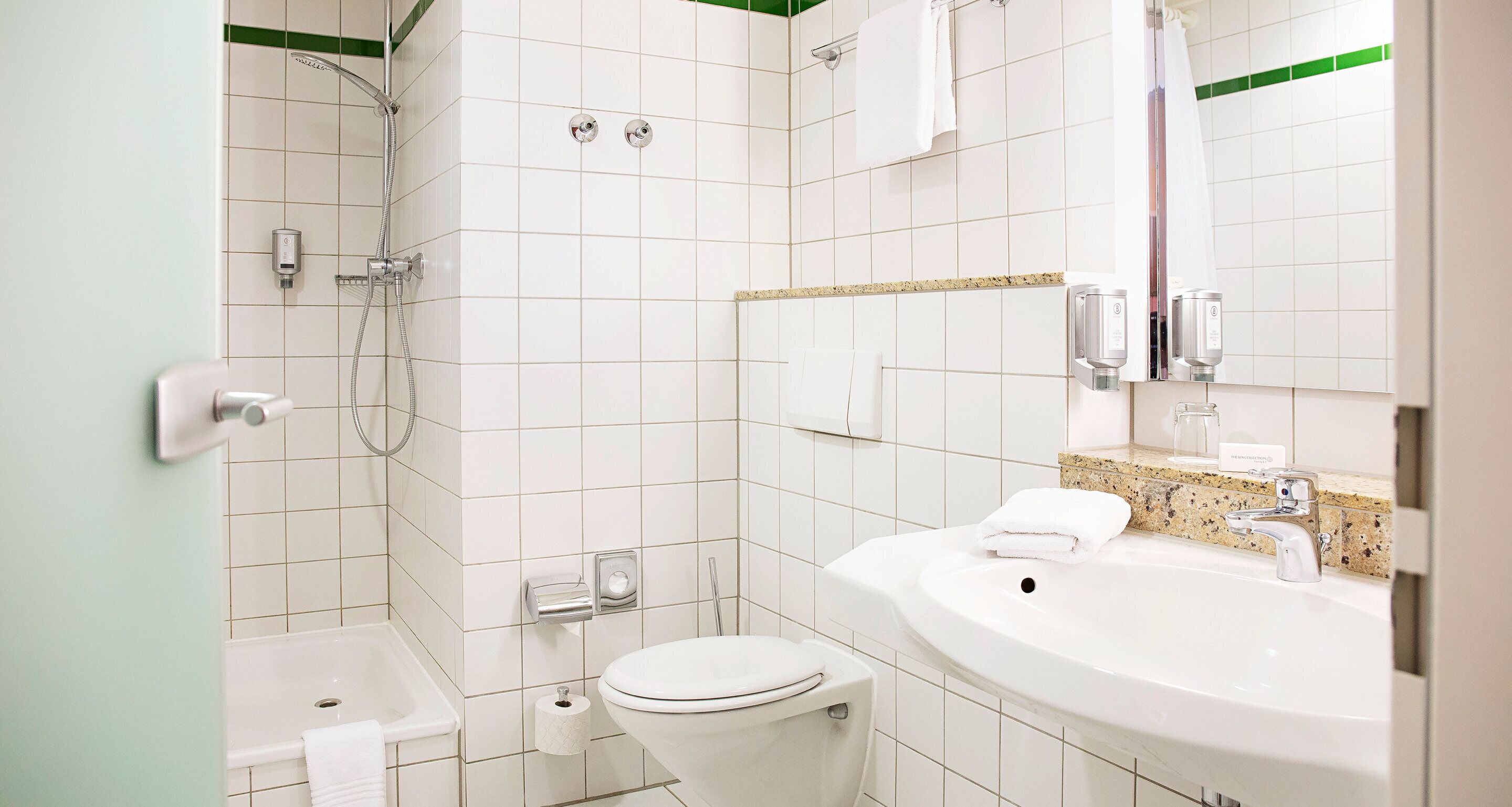 eco-friendly toiletries, hair dryer, slippers, towels