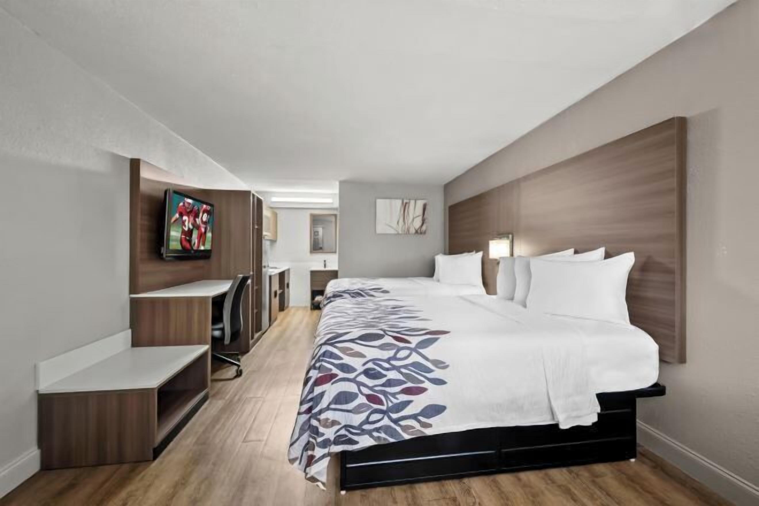 Desk, laptop workspace, blackout drapes, free cribs/infant beds