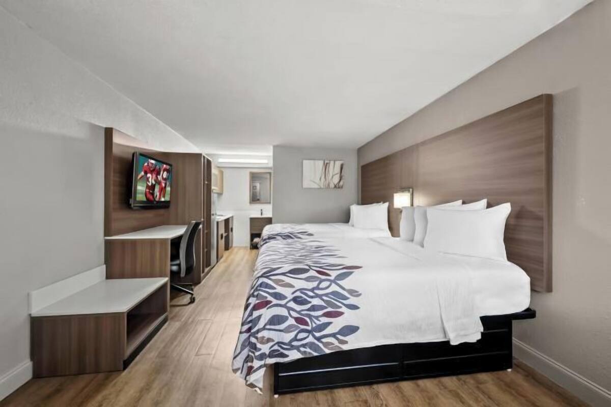 Desk, laptop workspace, blackout drapes, free cribs/infant beds