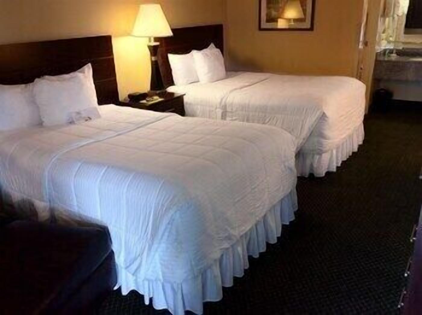 Pillowtop beds, desk, blackout drapes, iron/ironing board