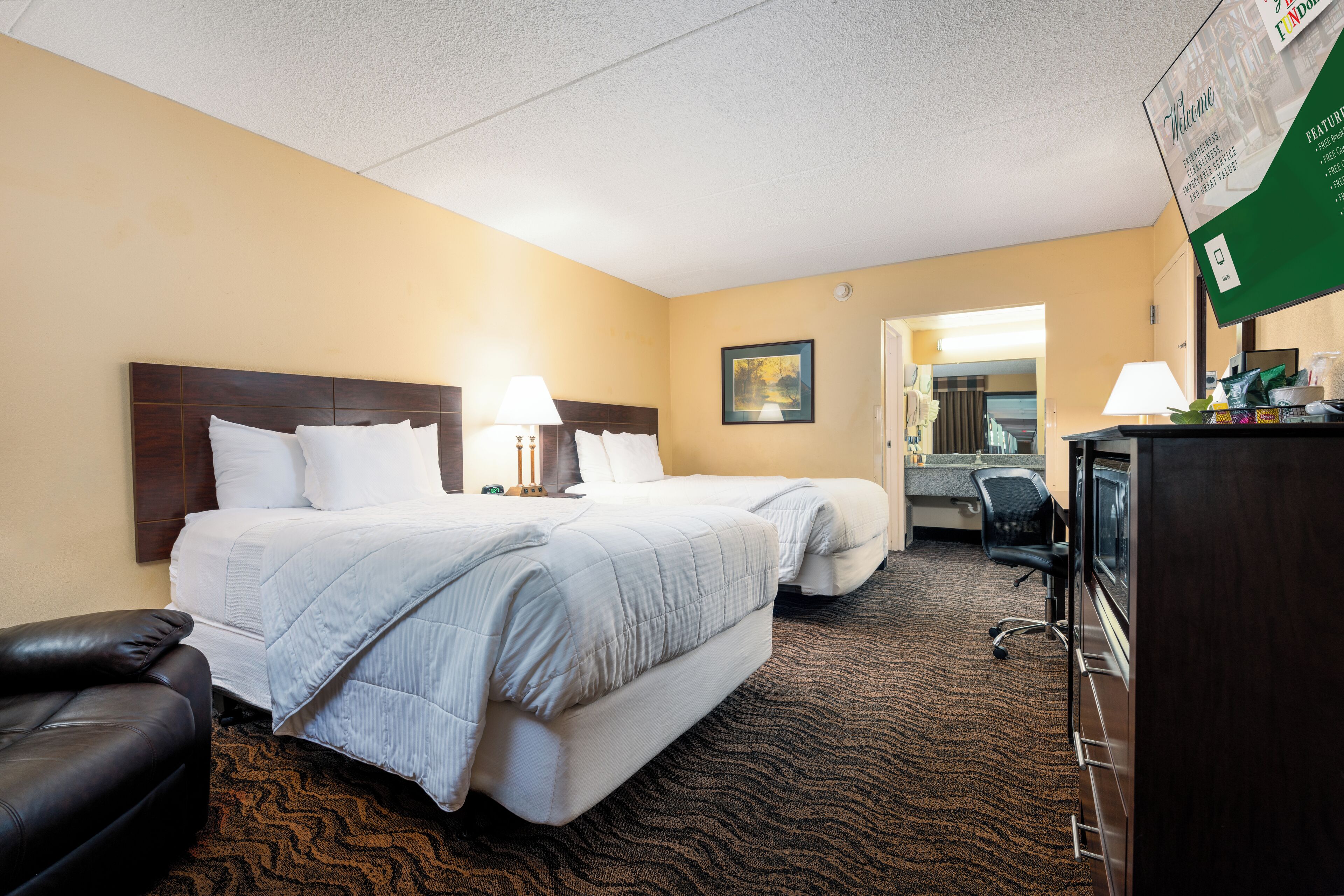 Pillow-top beds, desk, blackout curtains, iron/ironing board