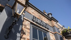 A building with a sign reading "GIRLISH" and a window with a black frame. - Blackwell Grange Hotel (Darlington)