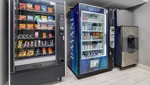 Two vending machines with snacks and drinks, and a water dispenser. - Red Roof Inn Parsippany (Parsippany)