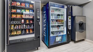 Two vending machines with snacks and drinks, and a refrigerator. - Red Roof Inn Parsippany (Parsippany)