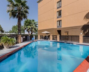 Outdoor pool, open 7:00 AM to 11:00 PM, pool umbrellas, pool loungers