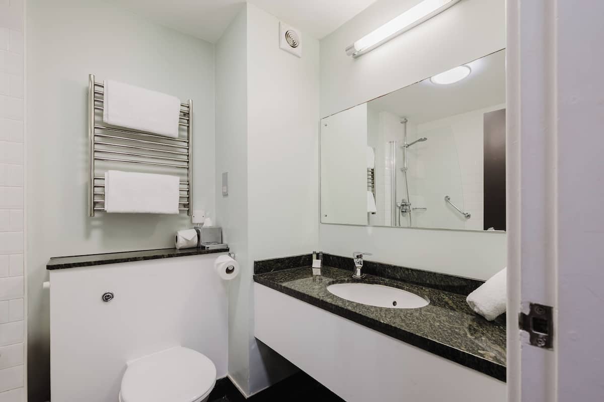 combined shower/bathtub, deep-soaking bathtub, designer toiletries