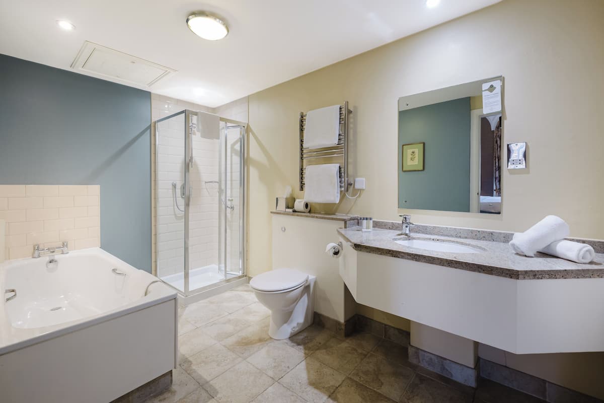 combined shower/bathtub, deep-soaking bathtub, designer toiletries