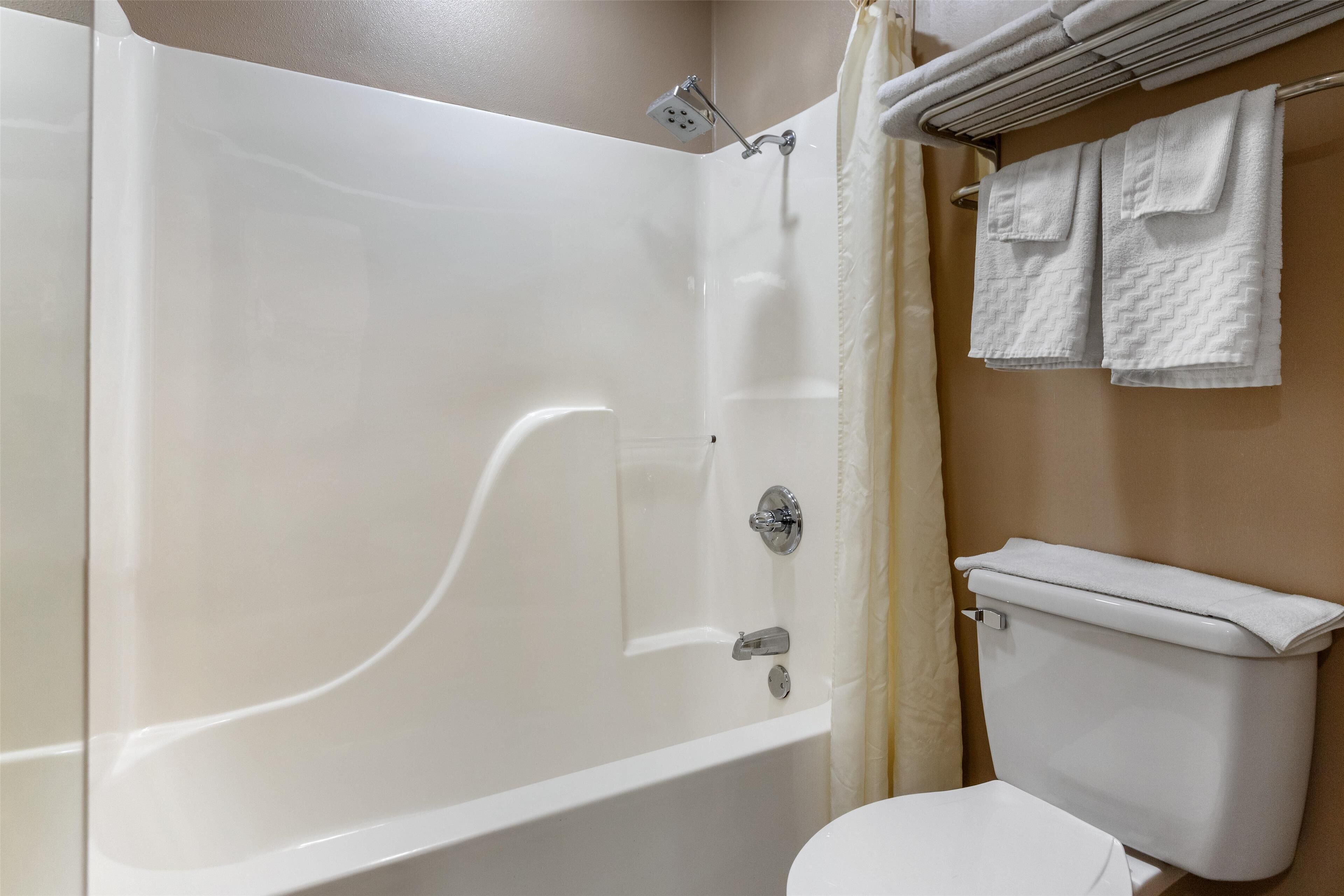 standard room, 2 queen beds, non smoking, refrigerator & microwave (dining table) | bathroom | combined shower/bathtub, free toiletries, hair dryer, towels