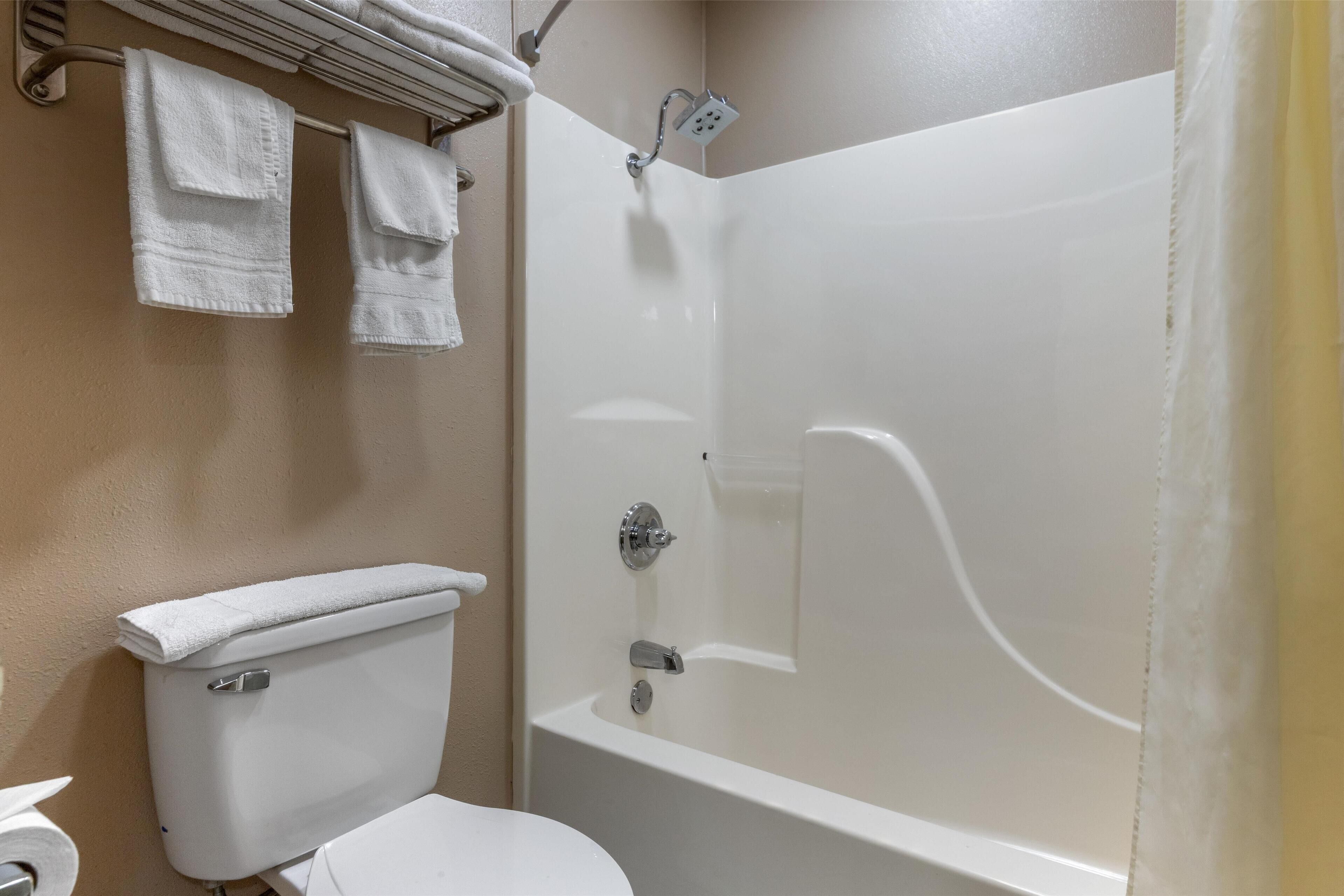 standard room, 2 queen beds, smoking, refrigerator & microwave (dining table) | bathroom | combined shower/bathtub, free toiletries, hair dryer, towels