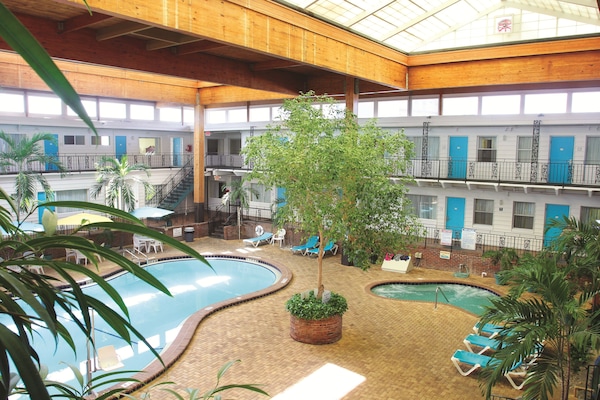 Indoor pool, 2 outdoor pools, open 9:00 AM to 10:00 PM, pool umbrellas